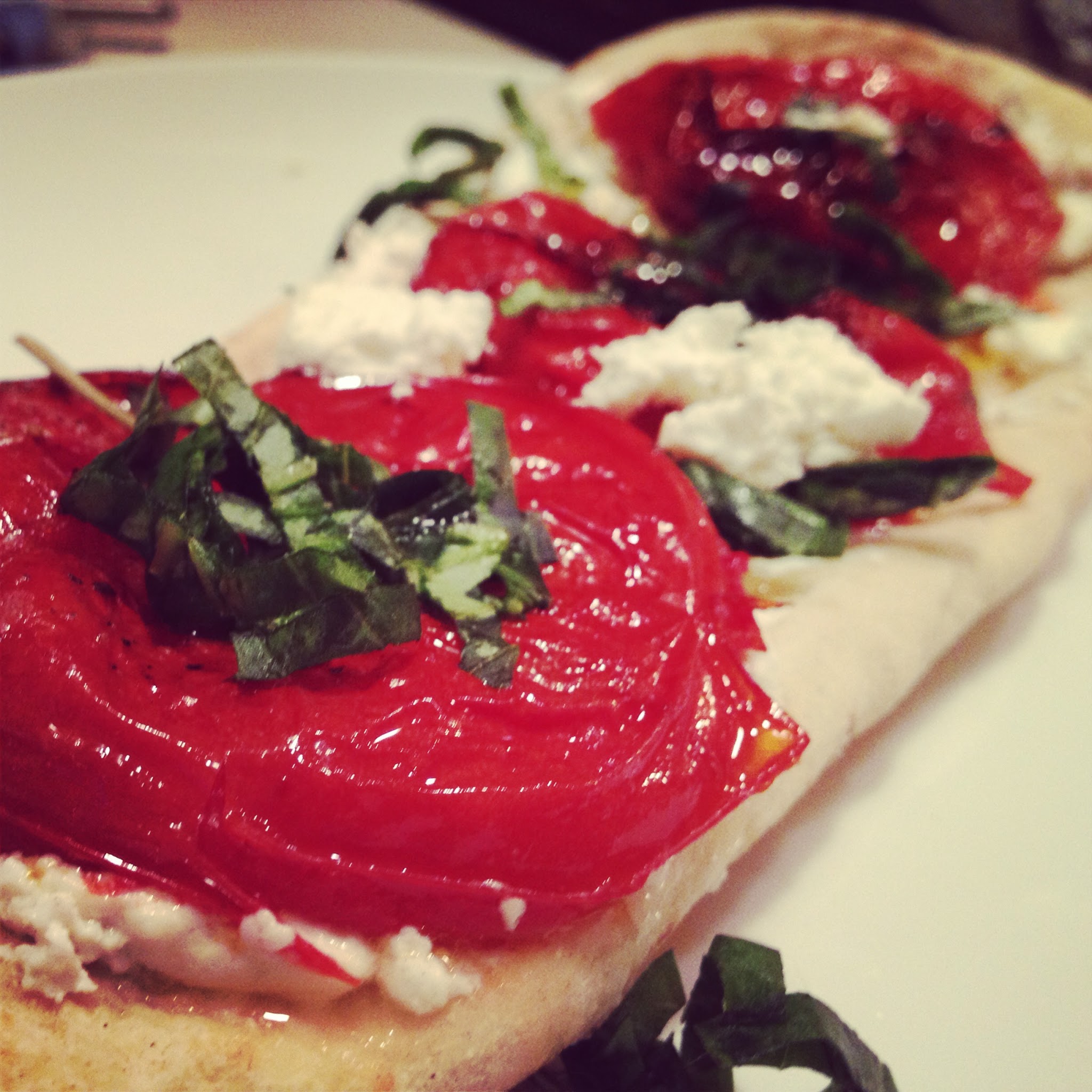 Roasted tomatoes with goat cheese on naan