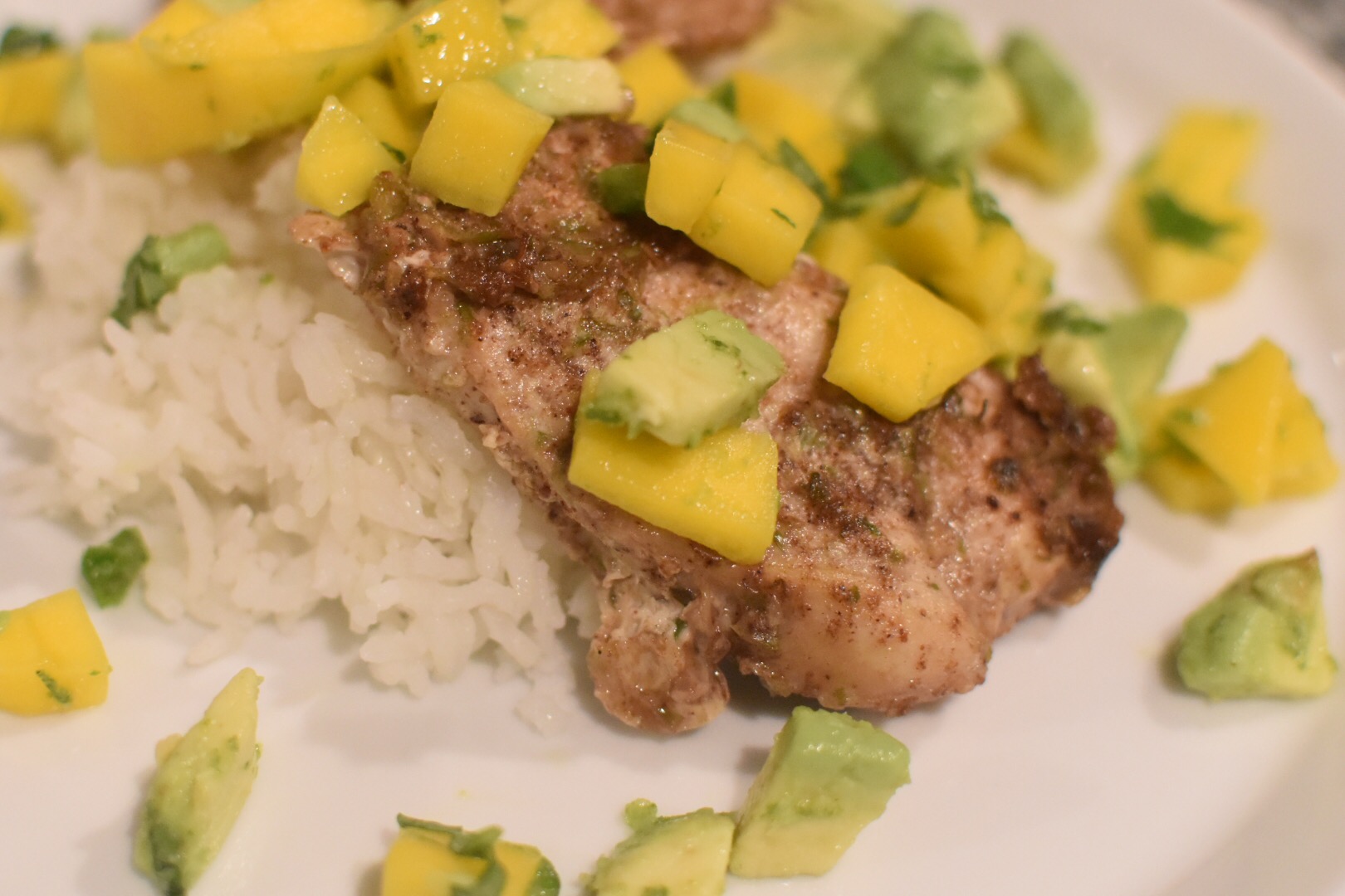 Jerk chicken with mango avocado salsa