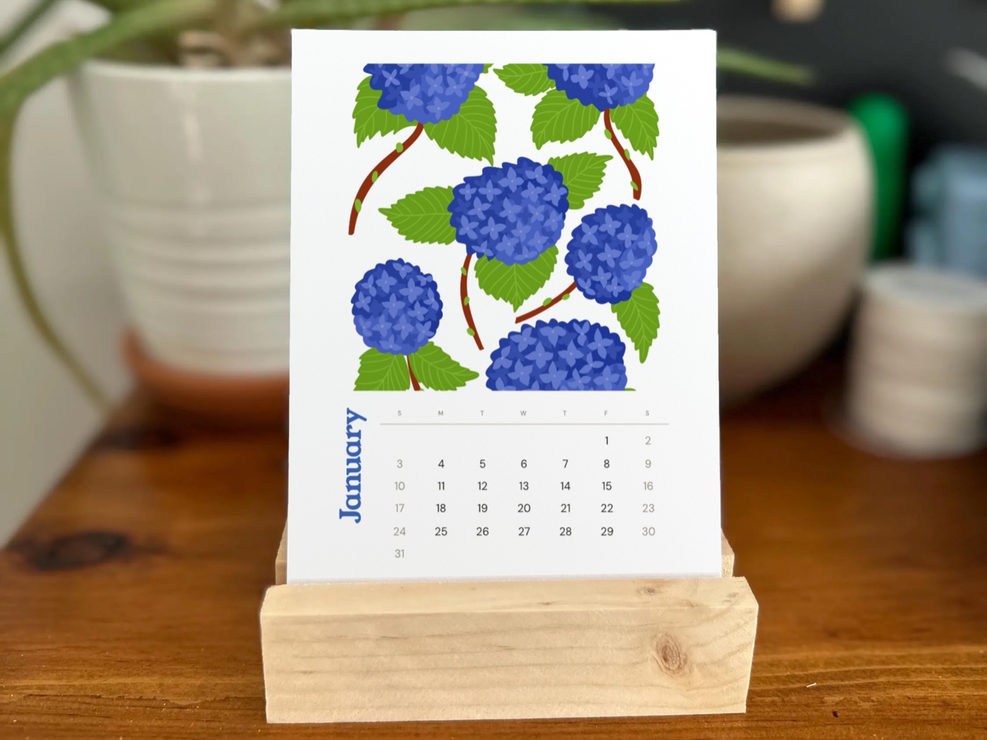 Hydrangea desk calendar on a wooden stand